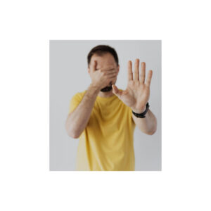 Man covering his face and raising one hand while experiencing headache and dizziness.
