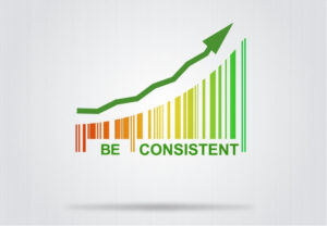 Green upward arrow above coloured bars with the words “Be Consistent”, representing consistent habits when managing migraine triggers.