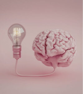 Brain connected to light bulb illustrating nervous system function involved in dizziness treatment