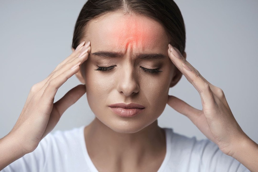migraines causes and triggers - woman having headache
